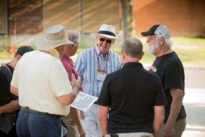 A group of retired alumni talking